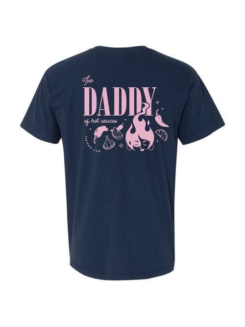 Back view of a navy t-shirt with a pink graphic and text reading "The daddy of hot sauces."